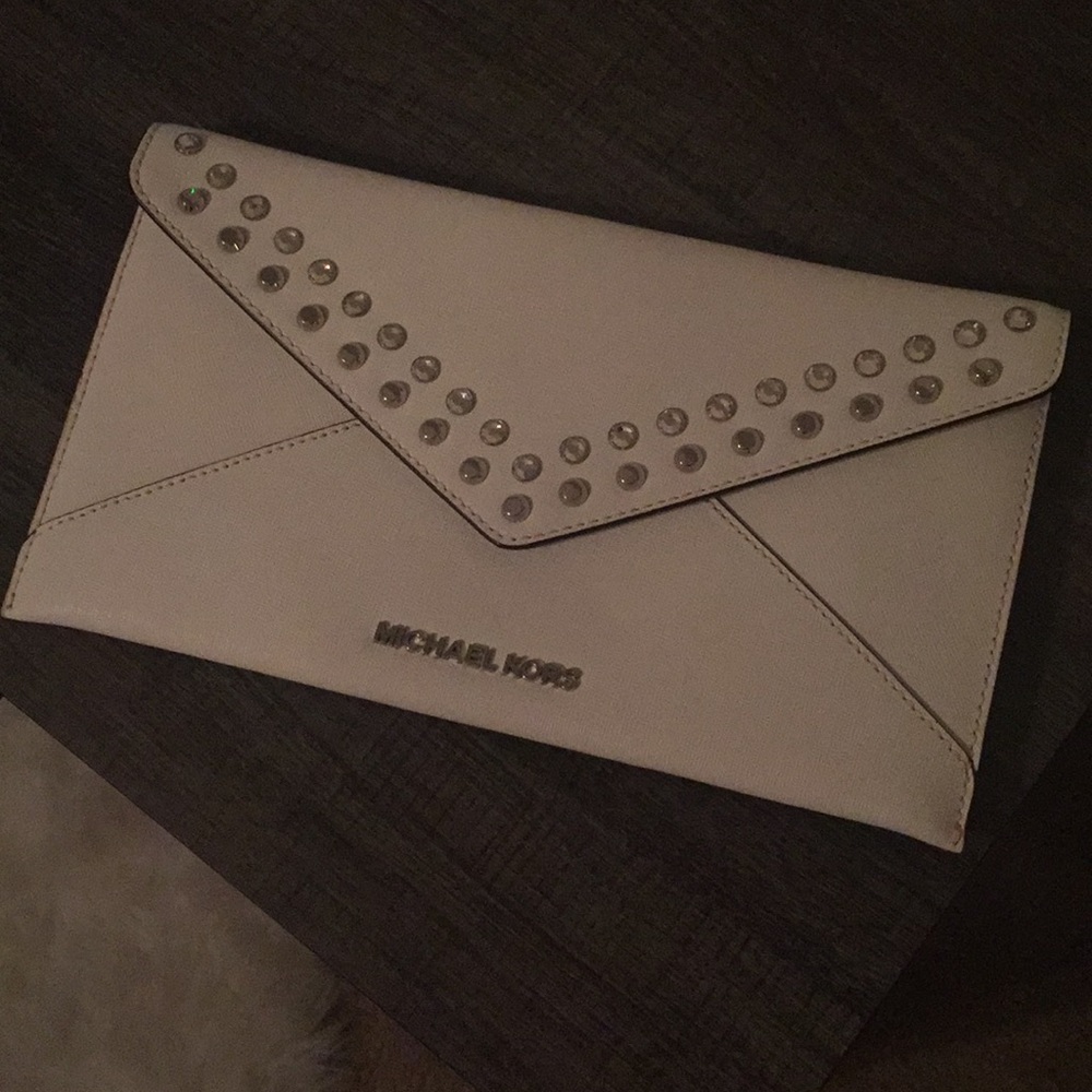 Brand new never used Michael Kors White Clutch